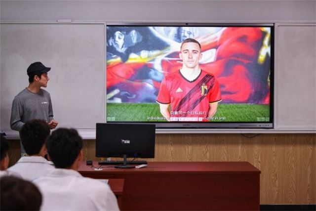 A picture containing text, person, television, electronics

Description automatically generated